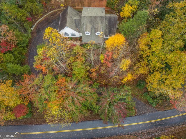 a view of a brick house with a yard