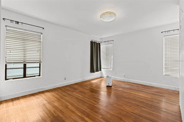 a kitchen with stainless steel appliances granite countertop a sink stove and wooden floor