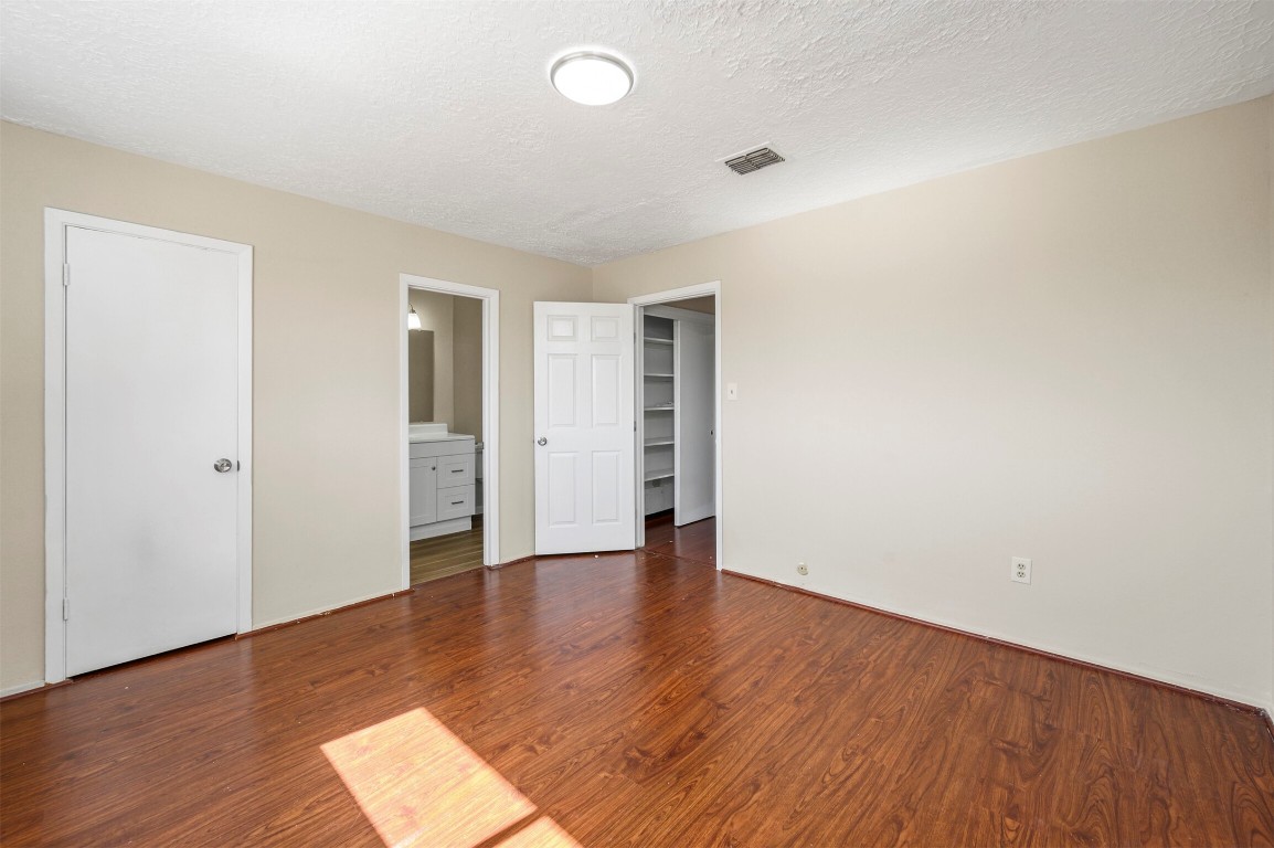 7236 Crownwest Street, Unit 7236 Houston, TX 77072 - Photo 15 of 21 a view of an empty room with wooden floor