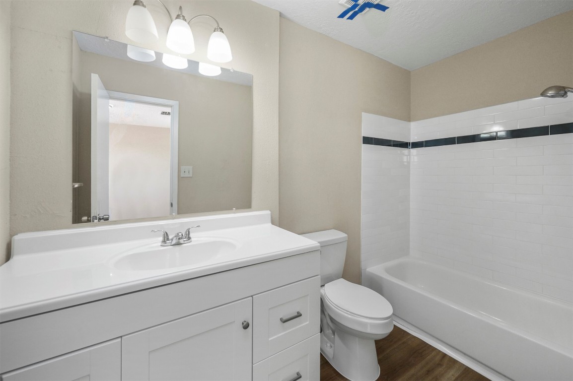 7236 Crownwest Street, Unit 7236 Houston, TX 77072 - Photo 16 of 21 a bathroom with a sink a toilet and shower