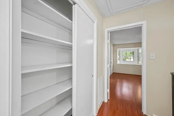 a view of an entryway with wooden floor