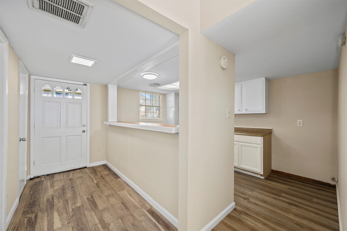 7236 Crownwest Street, Unit 7236 Houston, TX 77072 - Photo 3 of 21 a view of empty room with wooden floor
