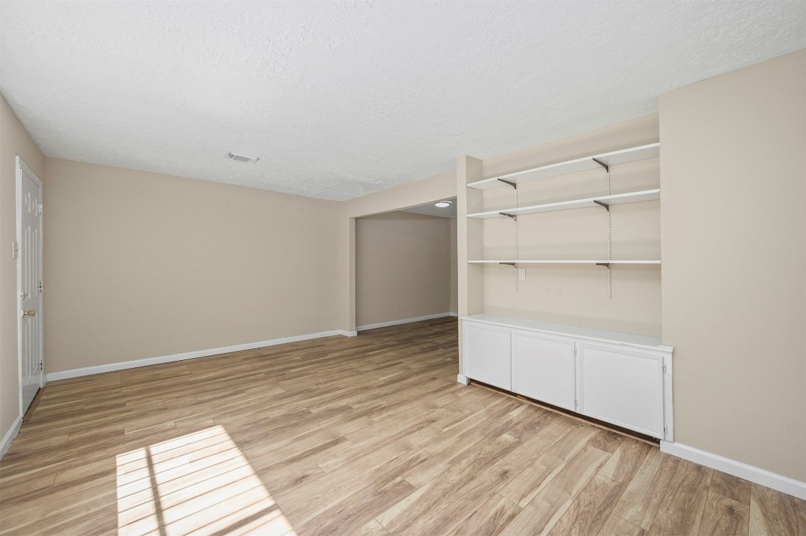 7236 Crownwest Street, Unit 7236 Houston, TX 77072 - Photo 8 of 21 a view of an empty walk in closet