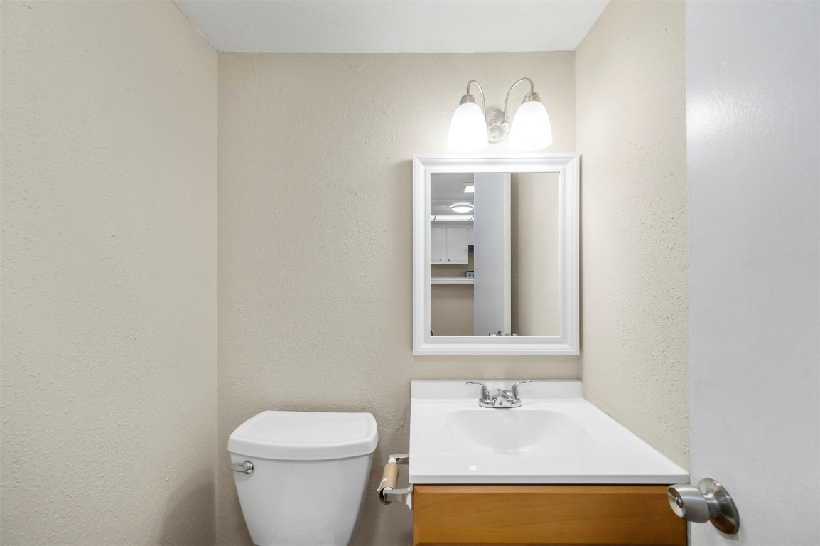 7236 Crownwest Street, Unit 7236 Houston, TX 77072 - Photo 10 of 21 a bathroom with a sink toilet and mirror