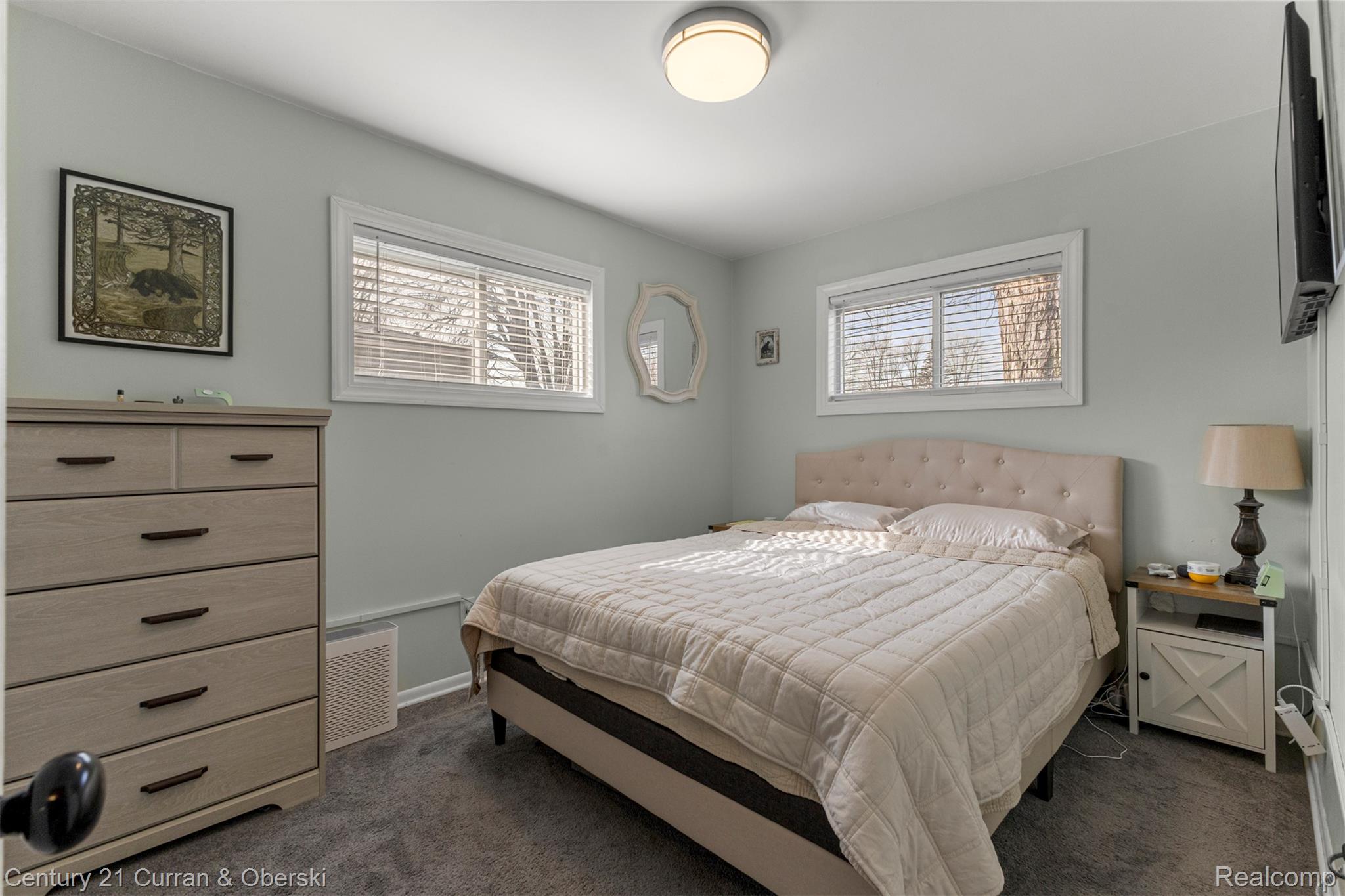 9329 Merriman Road Livonia, MI 48150 - Photo 15 of 32 Bedroom with dark carpet and baseboards