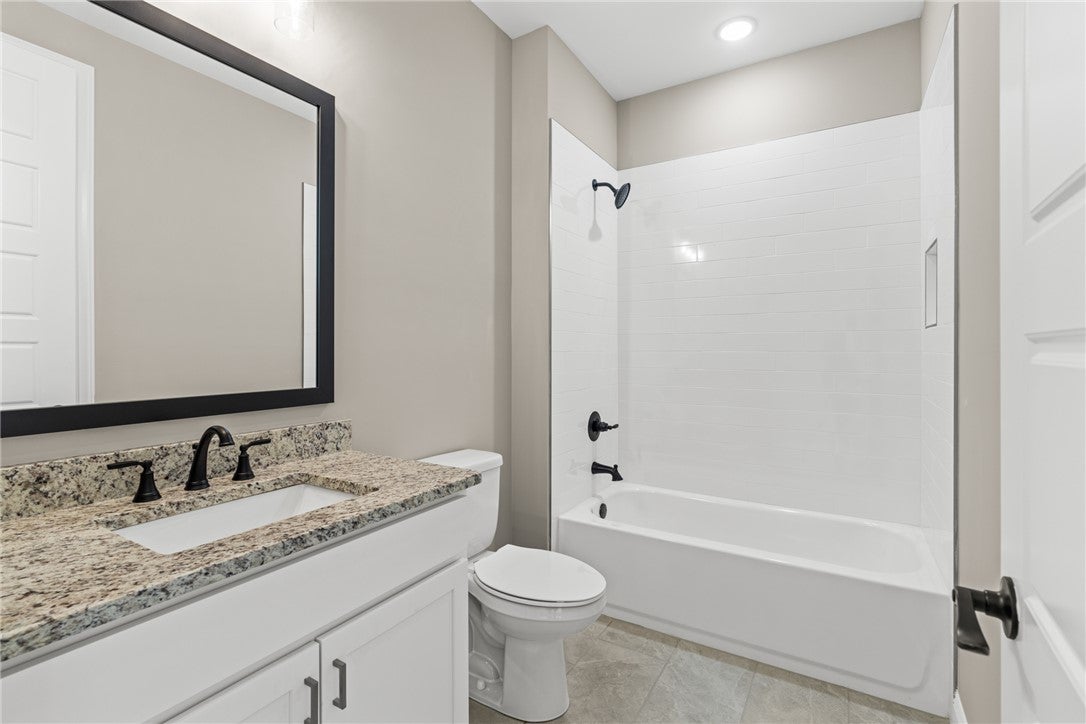 320 Coscoroba Road Auburn, AL 36832 - Photo 13 of 27 This clean and inviting bathroom features a stylish vanity and a classic tub with modern fixtures.