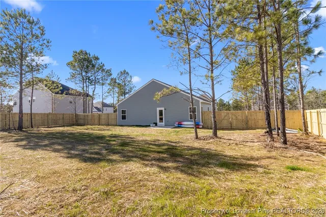 a house that has a tree in front of it
