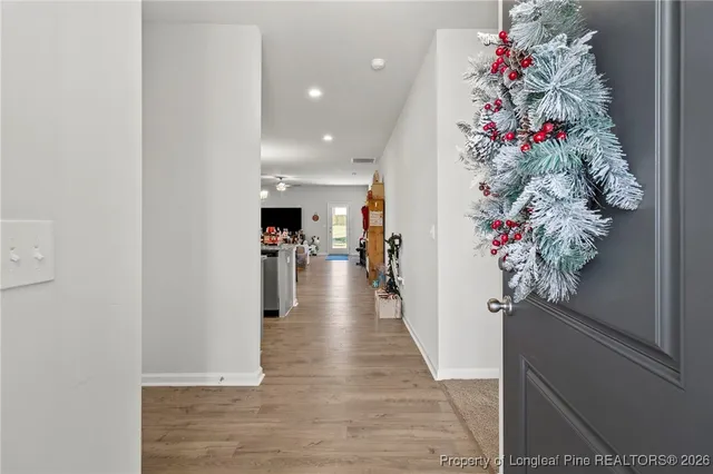 a hallway with flowers and flowers