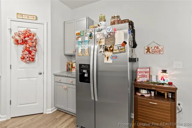 a white refrigerator freezer sitting inside of a kitchen