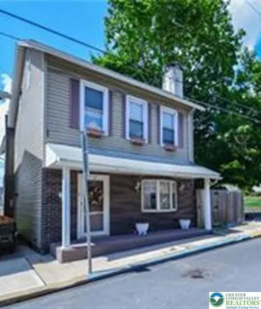 a front view of a house with a garage