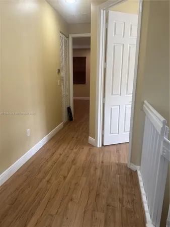 a view of wooden floor in an empty room