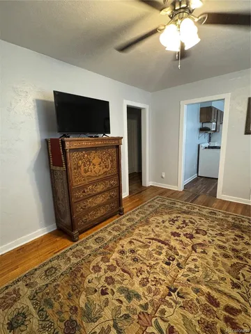 a living room with a flat screen tv and a fireplace