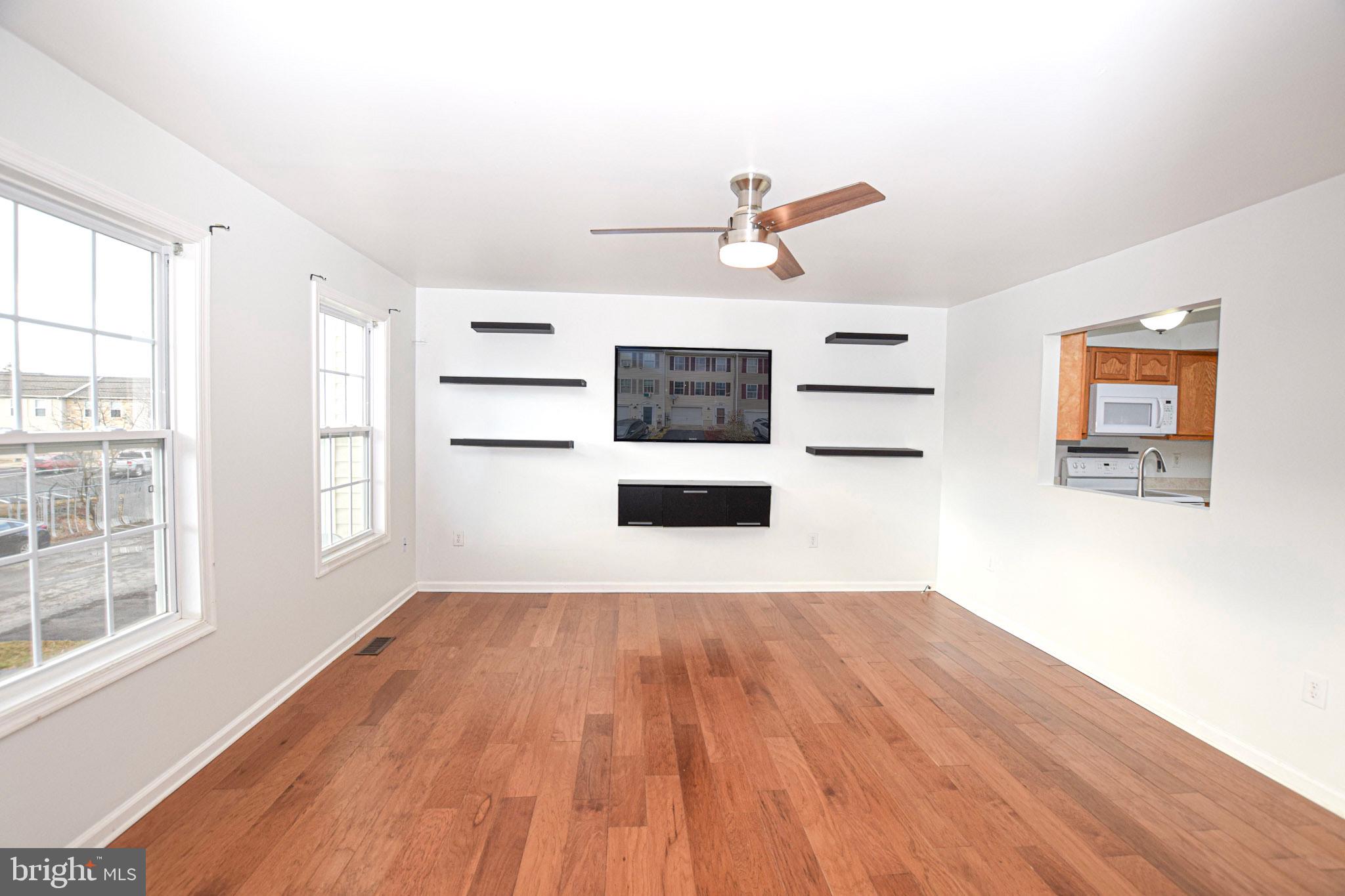 226 Topaz Lane Inwood, WV 25428 - Photo 14 of 32 an empty room with windows and cabinet