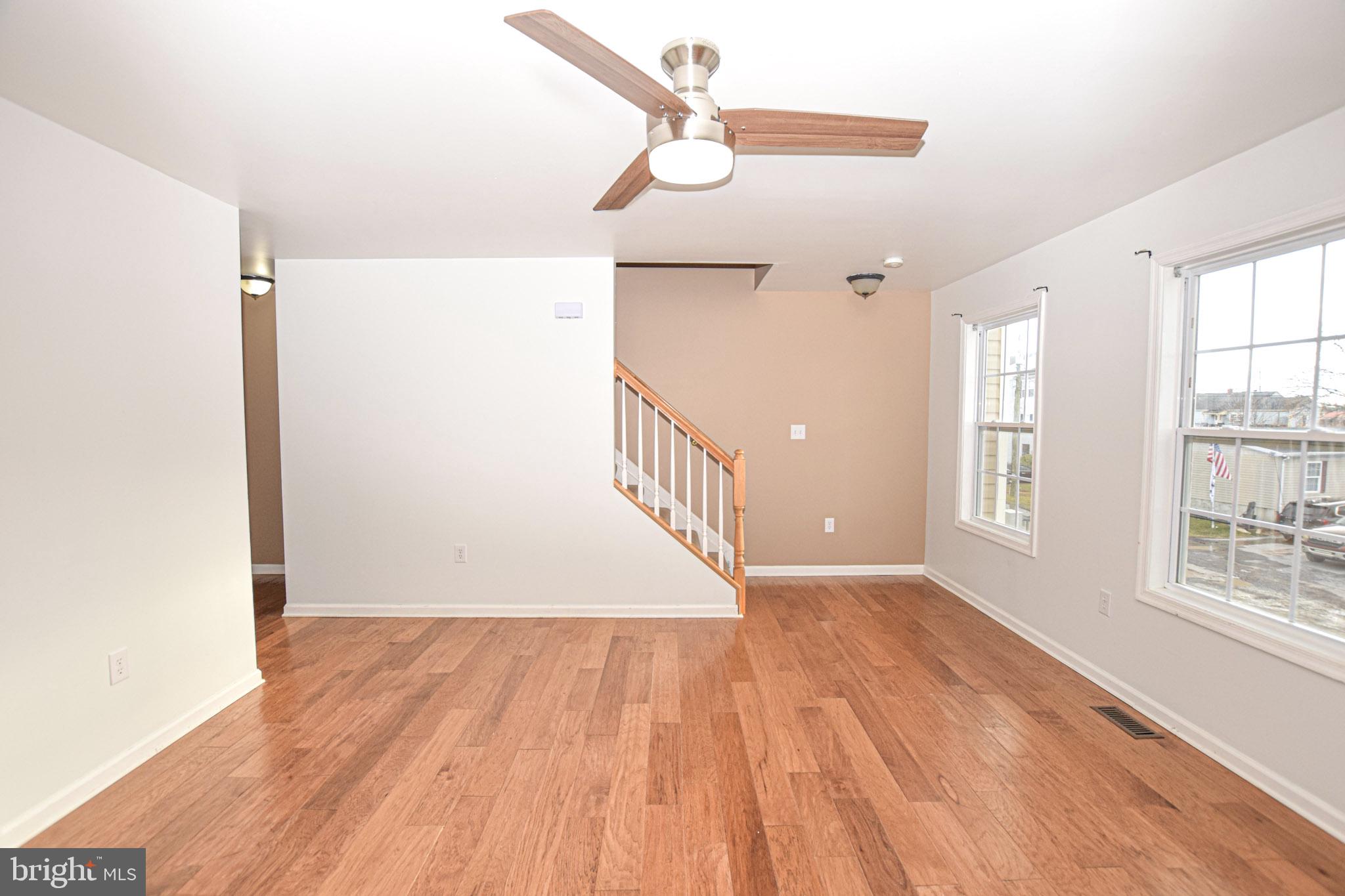 226 Topaz Lane Inwood, WV 25428 - Photo 16 of 32 a view of an empty room with wooden floor and a window