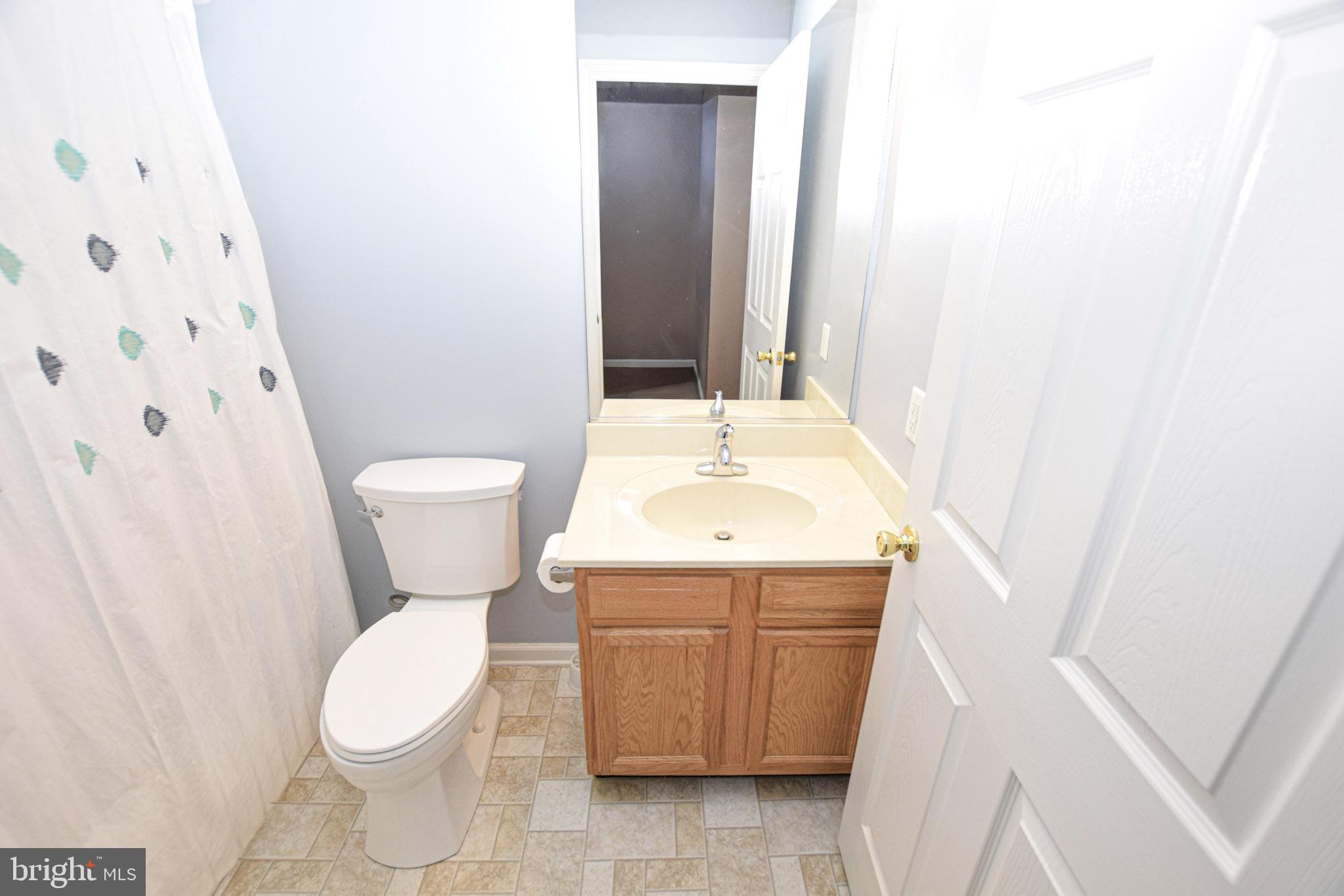 226 Topaz Lane Inwood, WV 25428 - Photo 17 of 32 a bathroom with a sink and a toilet