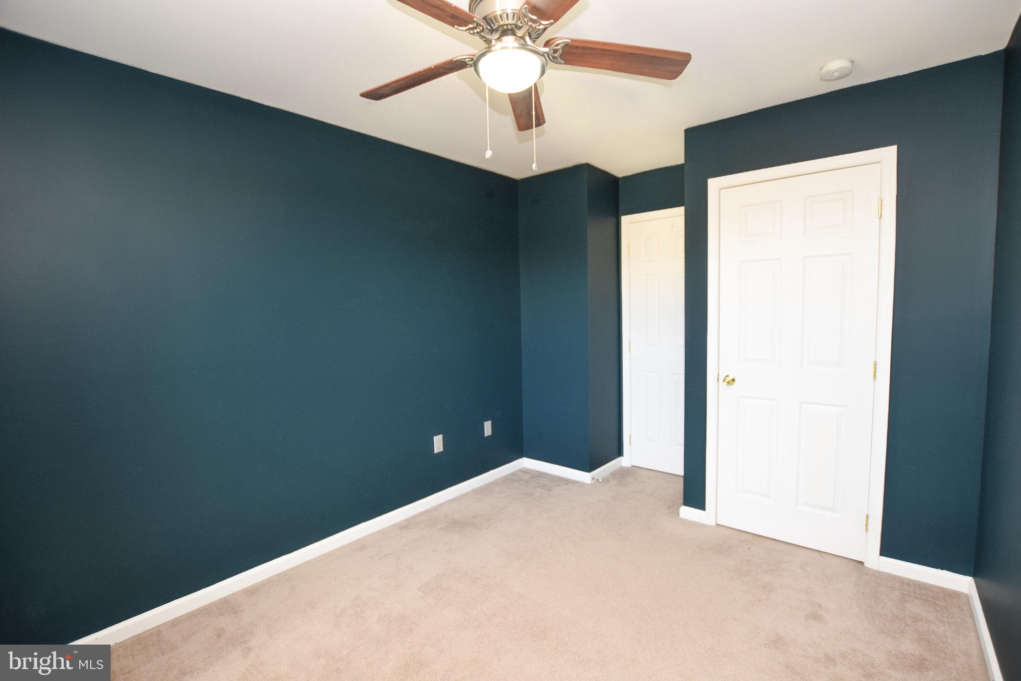 226 Topaz Lane Inwood, WV 25428 - Photo 19 of 32 a bedroom with a bed and a chandelier