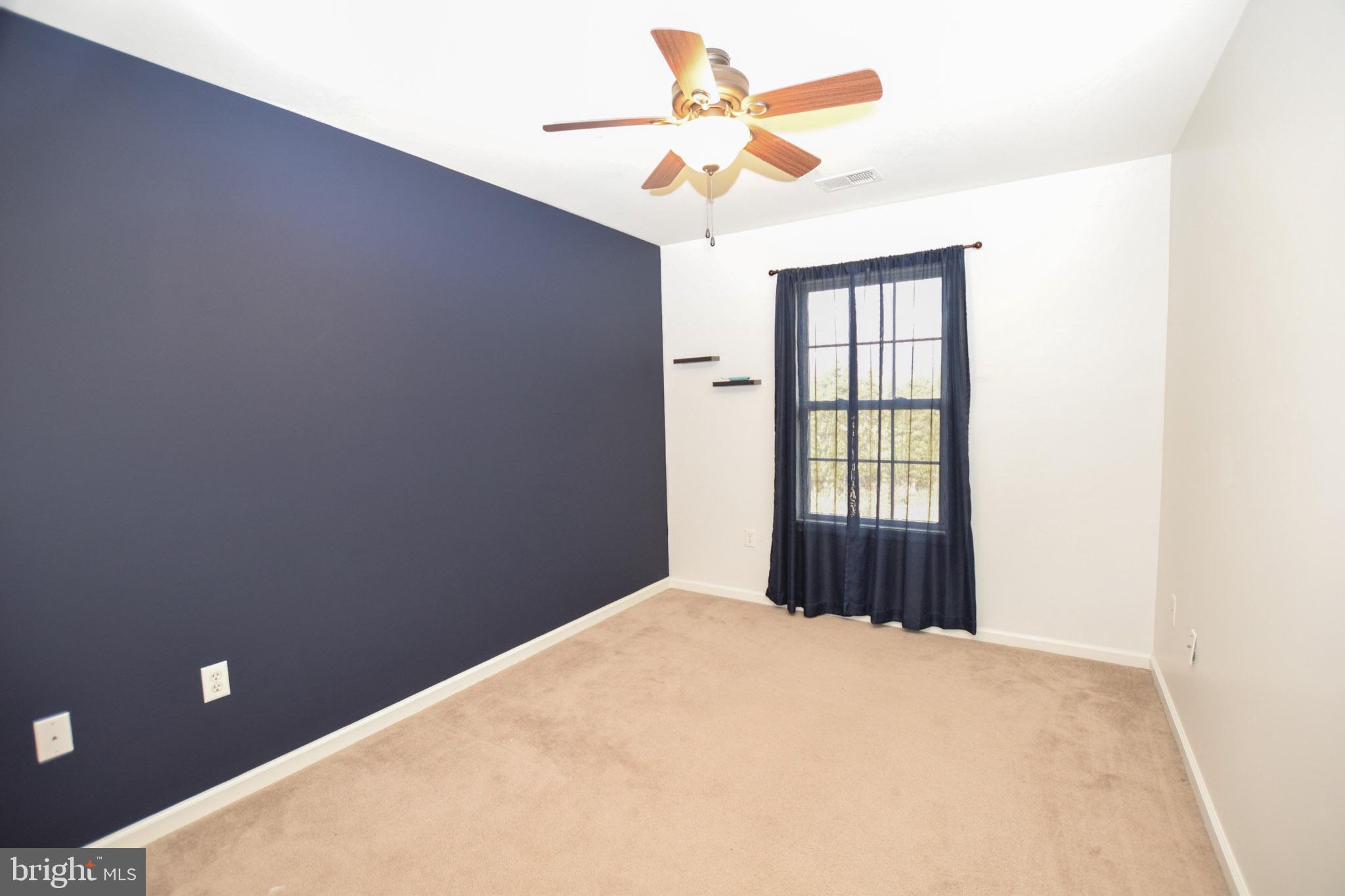 226 Topaz Lane Inwood, WV 25428 - Photo 20 of 32 a view of an empty room with a window