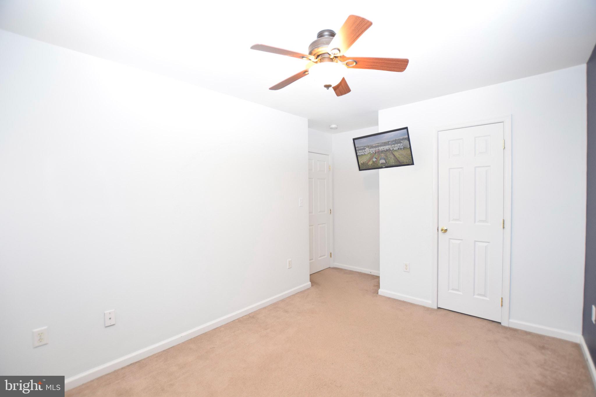 226 Topaz Lane Inwood, WV 25428 - Photo 21 of 32 an empty room with a fan