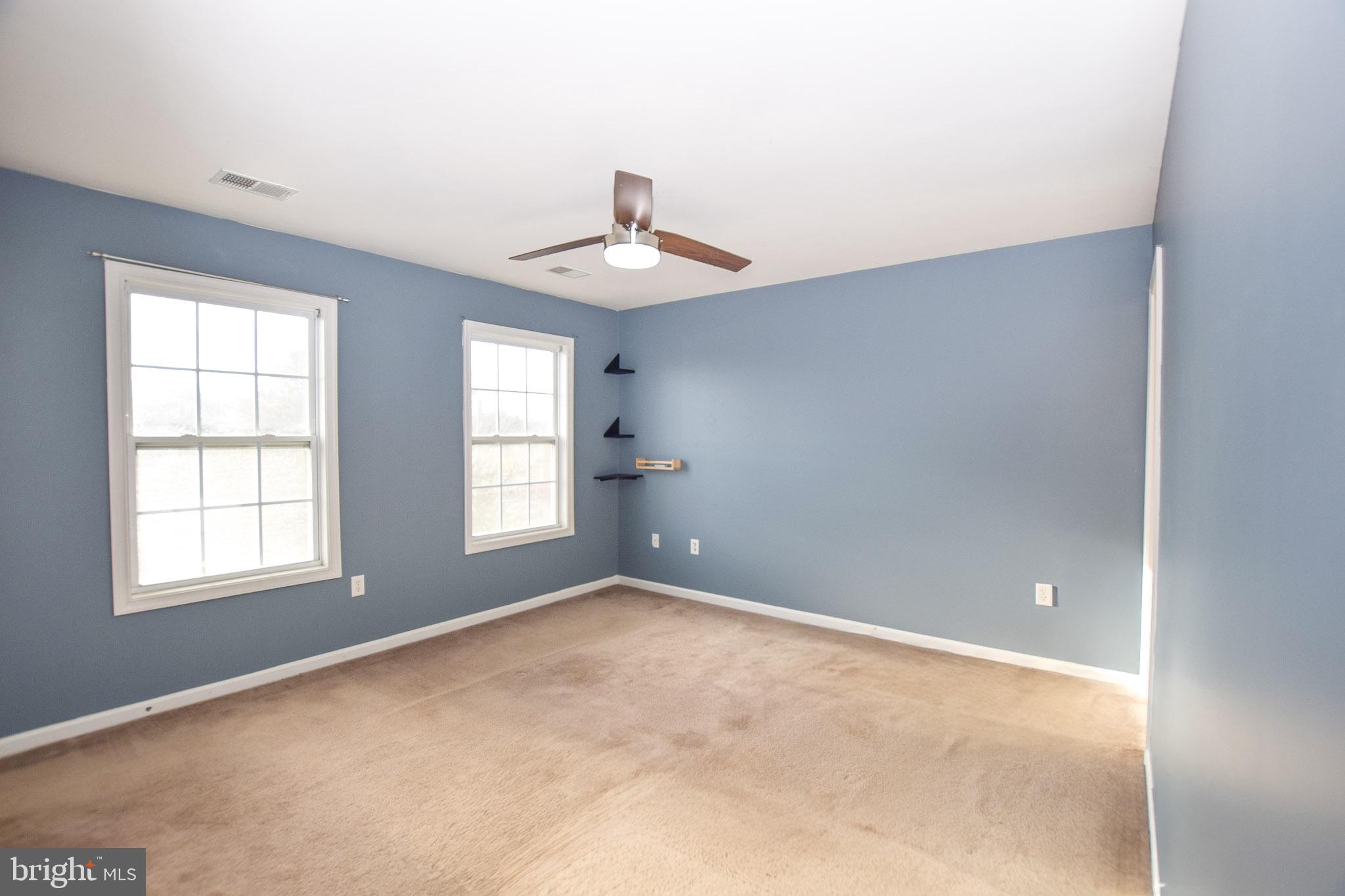 226 Topaz Lane Inwood, WV 25428 - Photo 22 of 32 an empty room with windows and closet