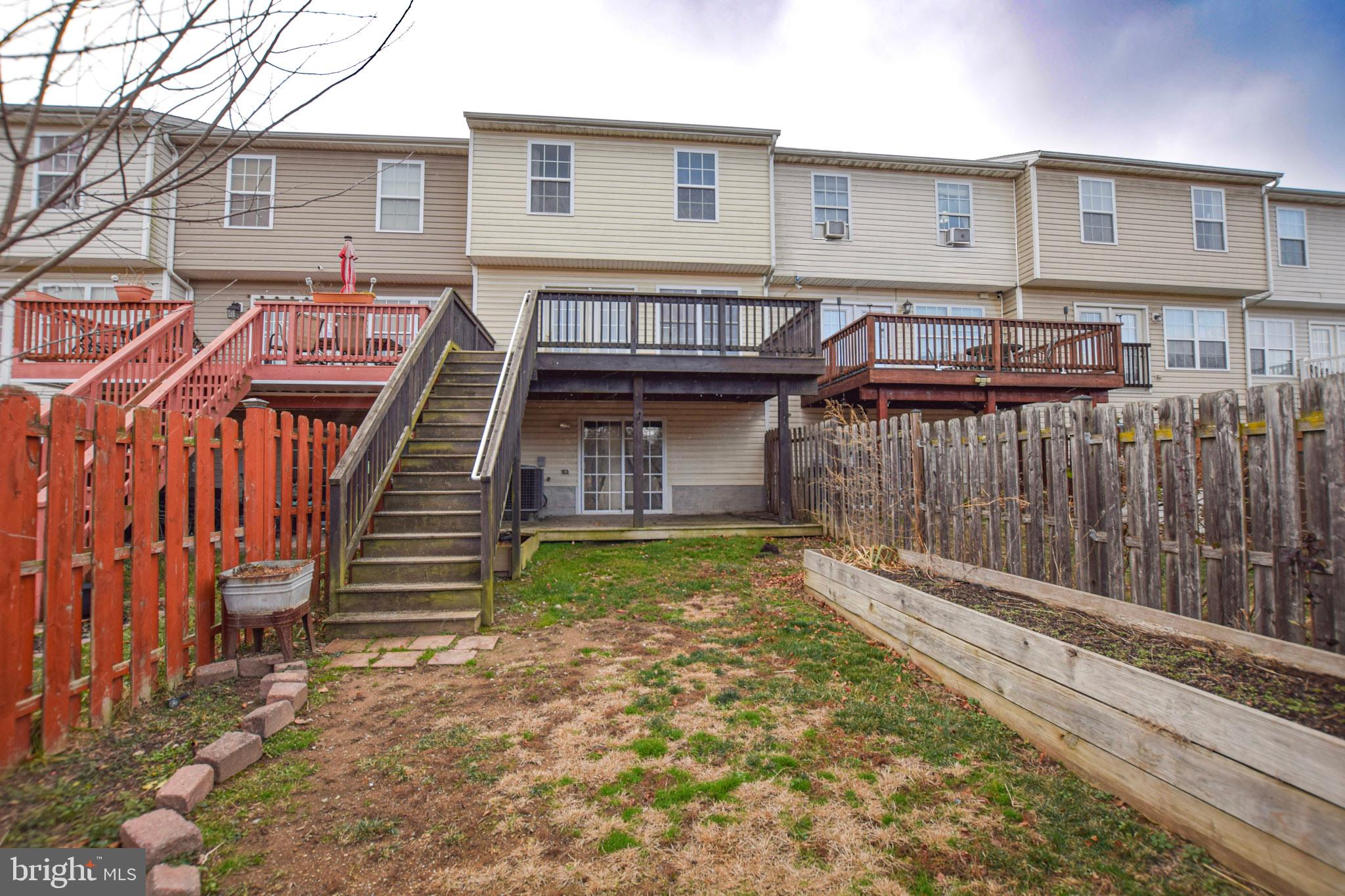 226 Topaz Lane Inwood, WV 25428 - Photo 31 of 32 a view of a house with backyard and wooden fence