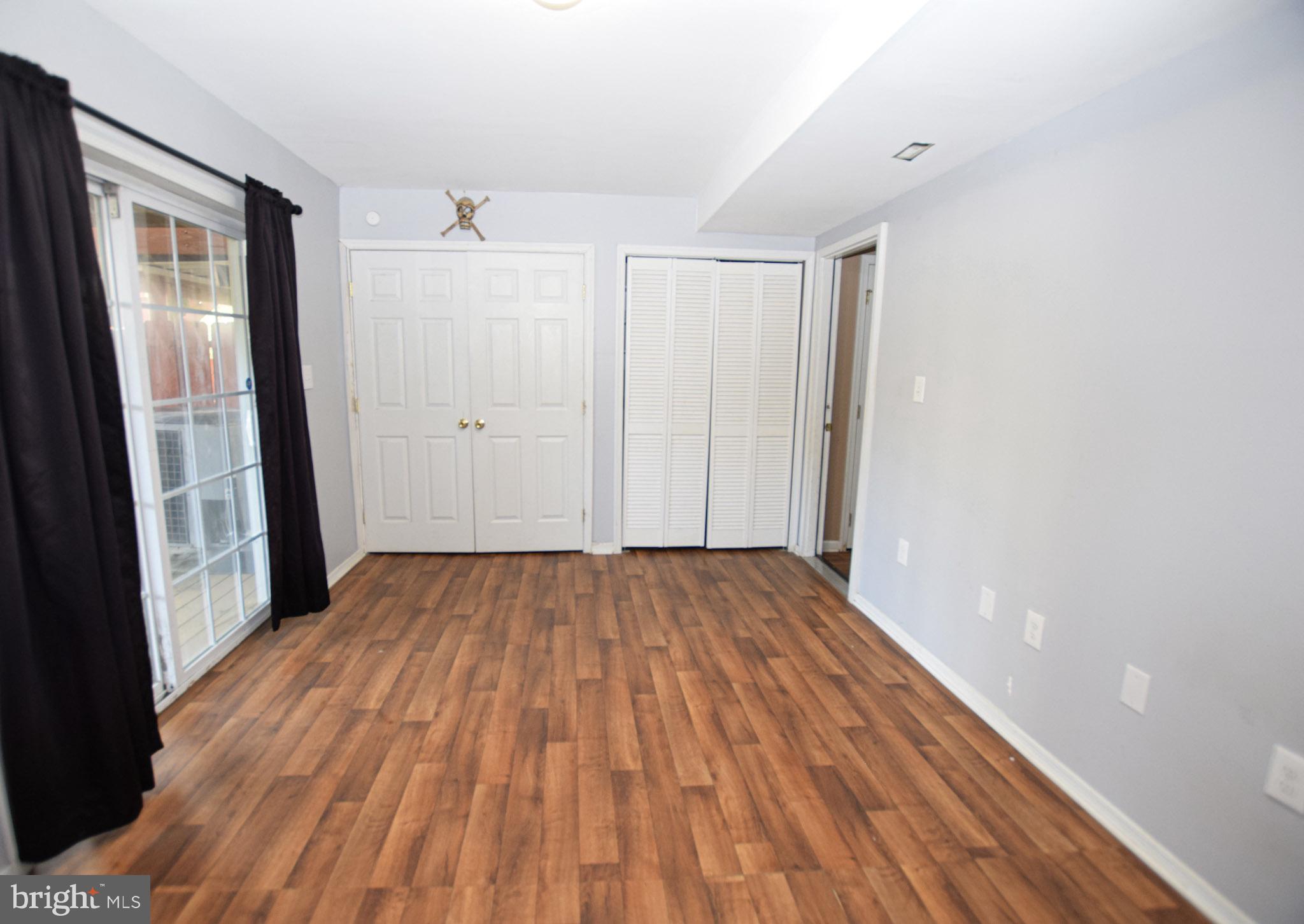 226 Topaz Lane Inwood, WV 25428 - Photo 5 of 32 a view of a room with wooden floor and white doors
