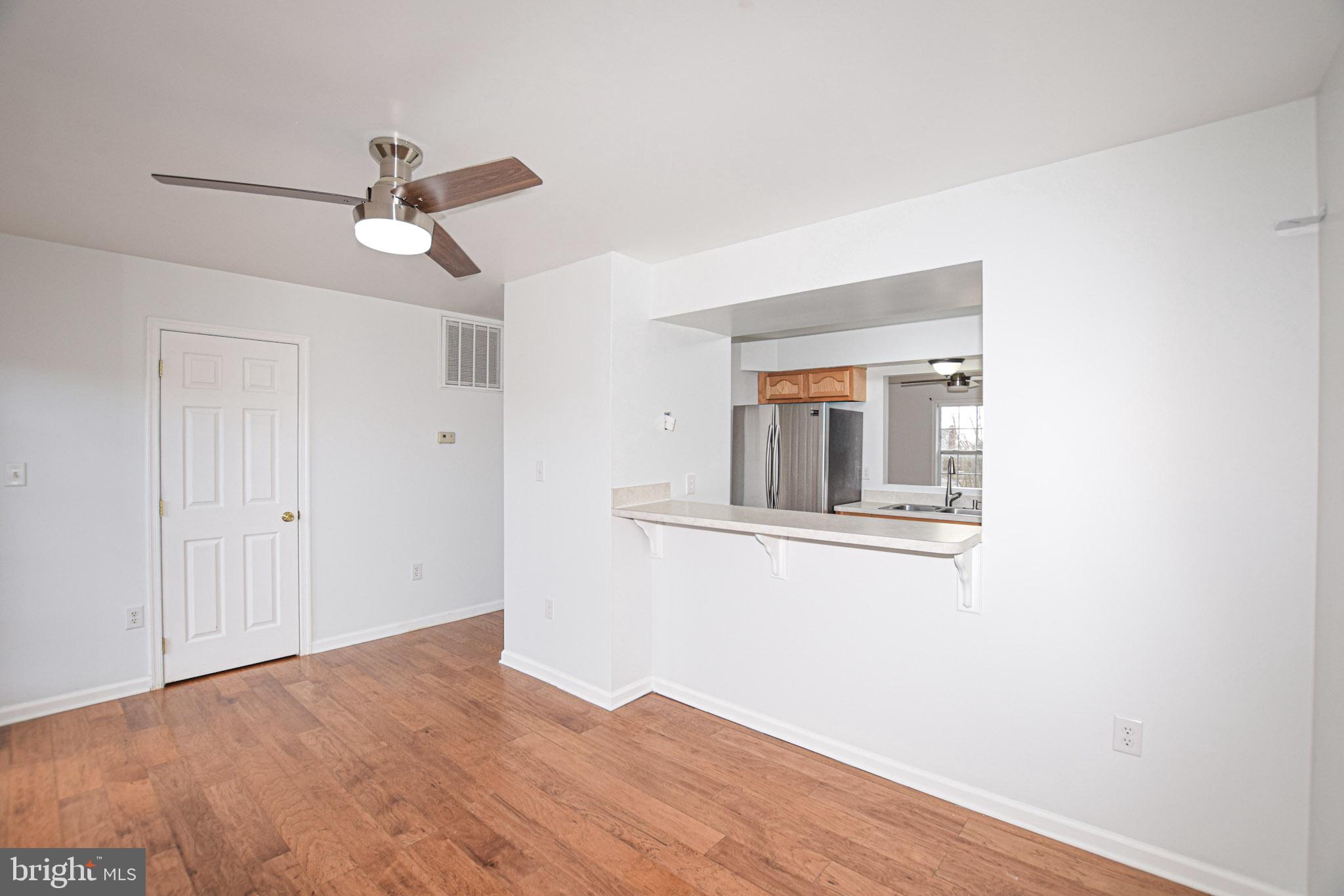 226 Topaz Lane Inwood, WV 25428 - Photo 10 of 32 a view of empty room with wooden floor and ceiling fan