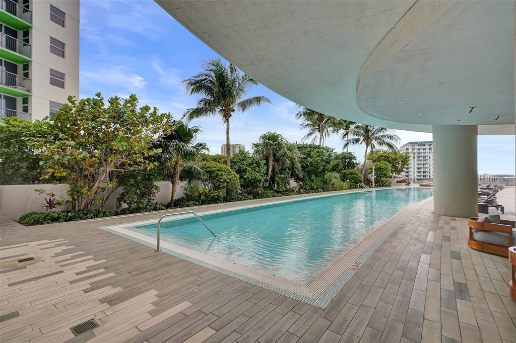 488 Northeast 18th Street, Unit 801 Miami, FL 33132 - Photo 24 of 46 a view of a swimming pool with a yard