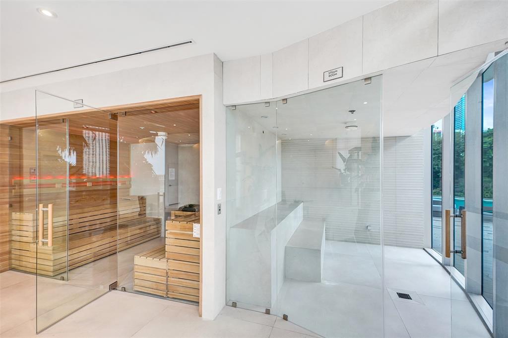488 Northeast 18th Street, Unit 801 Miami, FL 33132 - Photo 28 of 46 a bathroom with a glass shower door and a bathtub