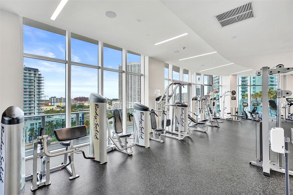 488 Northeast 18th Street, Unit 801 Miami, FL 33132 - Photo 31 of 46 a view of a livingroom with furniture and a floor to ceiling window