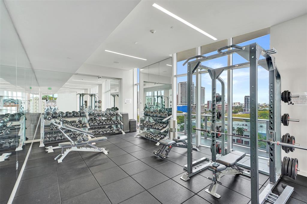 488 Northeast 18th Street, Unit 801 Miami, FL 33132 - Photo 32 of 46 a view of a room with gym equipment