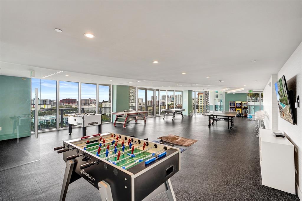 488 Northeast 18th Street, Unit 801 Miami, FL 33132 - Photo 39 of 46 a living room with furniture a rug and a floor to ceiling window