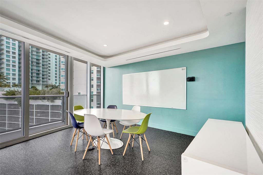 488 Northeast 18th Street, Unit 801 Miami, FL 33132 - Photo 41 of 46 a view of a dining room with furniture and a window