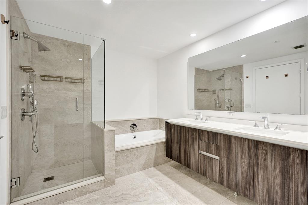 488 Northeast 18th Street, Unit 801 Miami, FL 33132 - Photo 8 of 46 a spacious bathroom with a shower sink and mirror