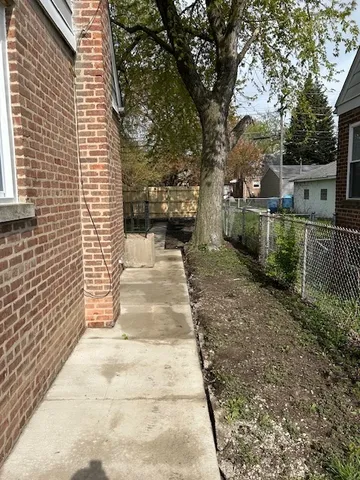a view of a chairs and table in the patio