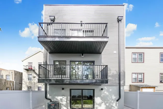 a view of a hallway with washer and dryer