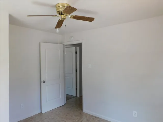 a very nice looking room with a ceiling fan