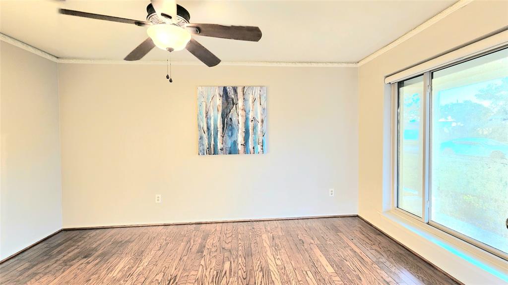 1911 Greenhaven Drive Richardson, TX 75080 - Photo 11 of 38 a view of empty room with wooden floor and fan