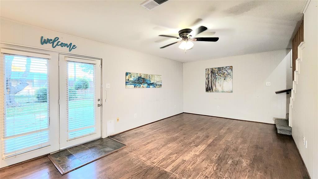 1911 Greenhaven Drive Richardson, TX 75080 - Photo 14 of 38 wooden floor in an empty room with a window