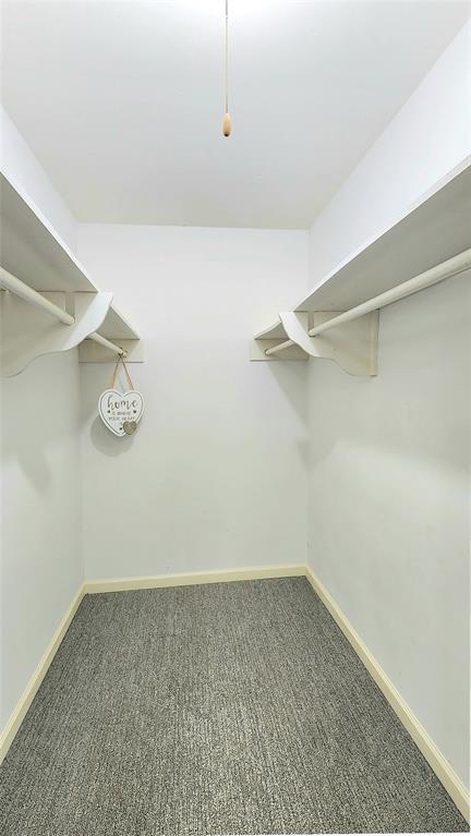 1911 Greenhaven Drive Richardson, TX 75080 - Photo 21 of 38 a view of a room with racks on the wall