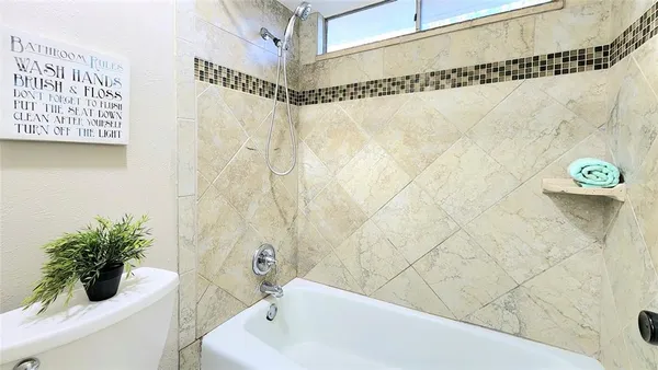 a bathroom with a shower curtain and a bathtub
