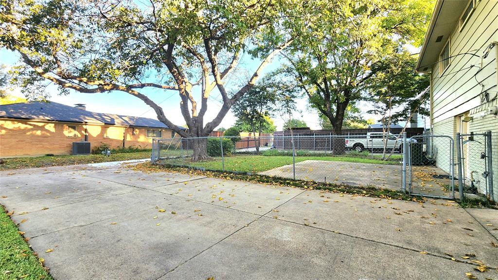 1911 Greenhaven Drive Richardson, TX 75080 - Photo 36 of 38 a view of a house with a big yard