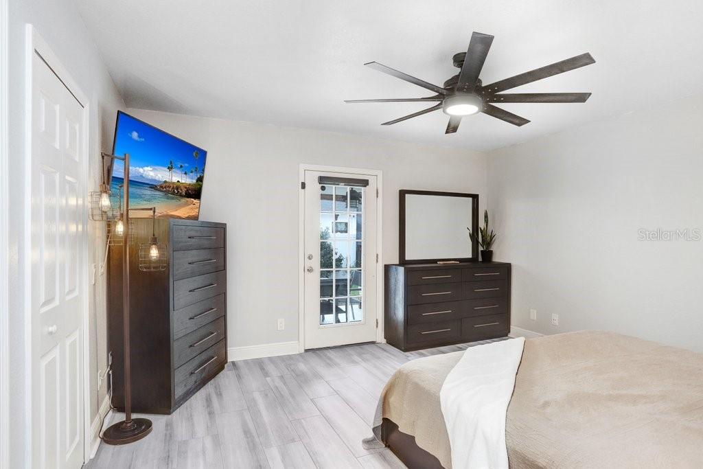 3122 West Grace Street Tampa, FL 33607 - Photo 16 of 31 a bedroom with a bed and a dresser