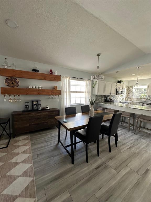 3122 West Grace Street Tampa, FL 33607 - Photo 17 of 46 a living room with lots of furniture and kitchen view
