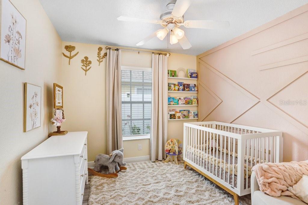 3122 West Grace Street Tampa, FL 33607 - Photo 23 of 46 a bedroom with furniture and a window