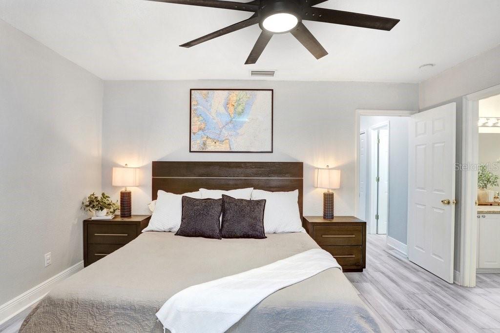 3122 West Grace Street Tampa, FL 33607 - Photo 25 of 46 a bedroom with a bed and painting on the wall