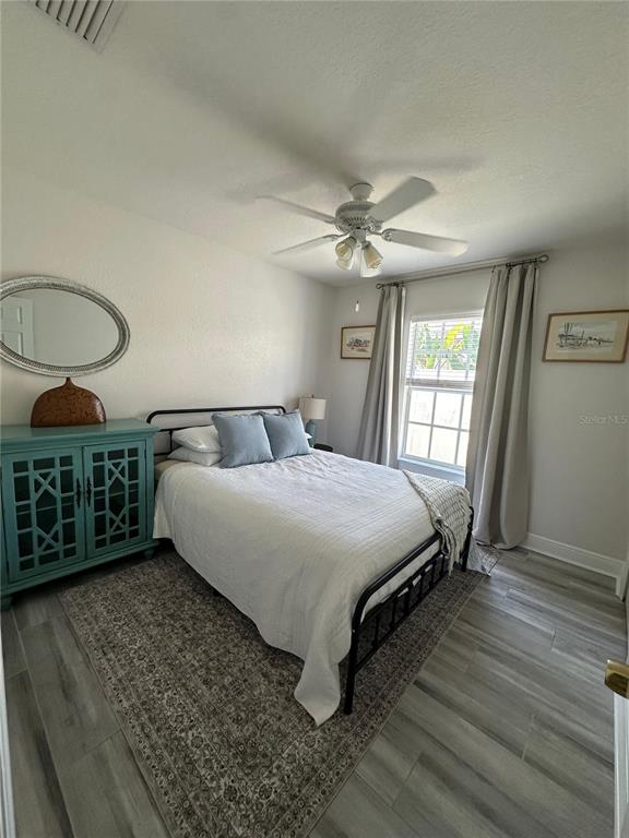 3122 West Grace Street Tampa, FL 33607 - Photo 29 of 46 a bedroom with a bed a window and dresser