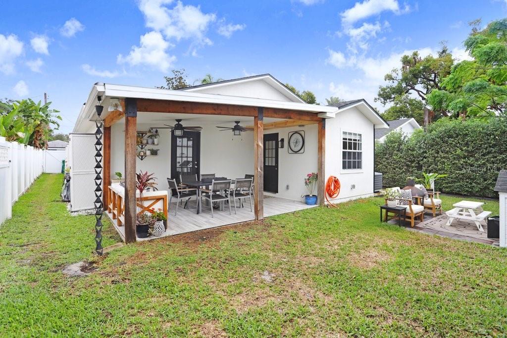 3122 West Grace Street Tampa, FL 33607 - Photo 38 of 46 a view of a house with backyard and porch