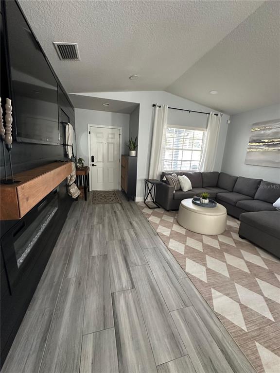 3122 West Grace Street Tampa, FL 33607 - Photo 8 of 46 a living room with a couch and a window