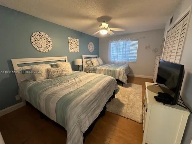 a bedroom with bed and a chandelier