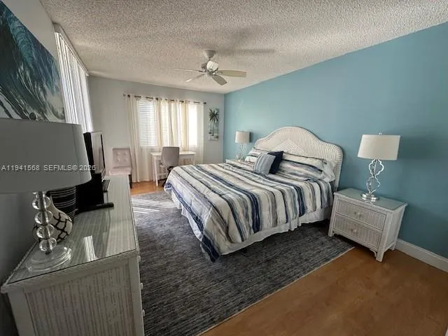 a spacious bedroom with a bed and window